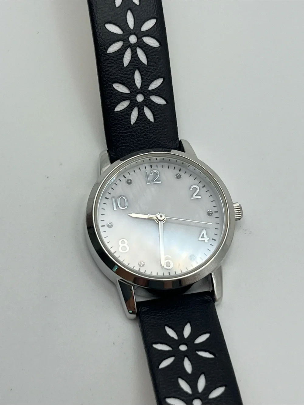 Women's Black Floral Cutout Strap Watch with Silver Case